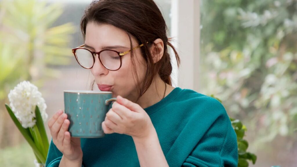 Woman is blowing into hot drink 1296x728 header 1