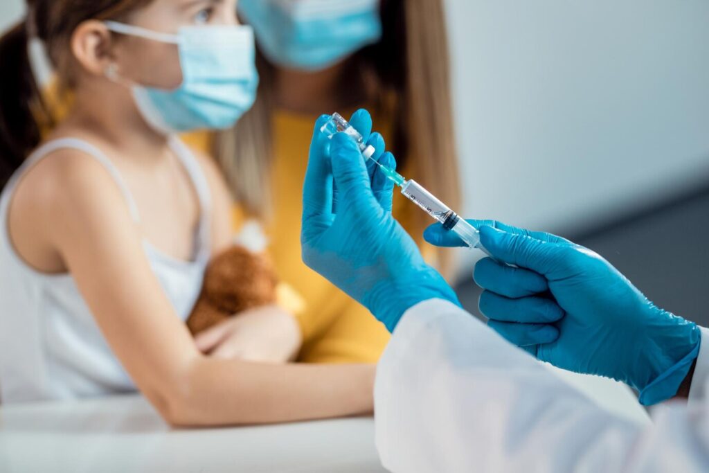 closeup doctor preparing syringe child s vaccination 637285 11288